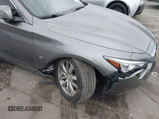 2015 Infiniti Q50 Premium z VIN JN1BV7AR7FM408015, wystawiony jako IAAI lot #42083301 z przebiegiem 58 817 mil mil oraz . Historia ofert i sprzedaży dostępna na DreamBid. Obrazek 6.
