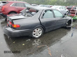 2000 Toyota Camry CE z VIN JT2BG22K7Y0479410, wystawiony jako Copart lot #57871825 z przebiegiem 222 941 mil mil oraz Tytuł czysty. Historia ofert i sprzedaży dostępna na DreamBid. Obrazek 3.