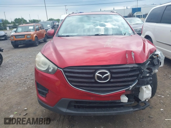 2016 Mazda CX-5 Sport with VIN JM3KE4BY3G0635882, listed as a IAAI auction lot 42545799 with 144,247 mi miles and . Bid and sale history available at DreamBid. Image 12.