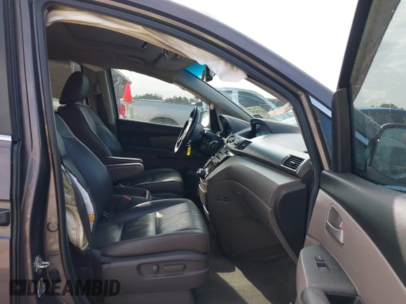 2012 Honda Odyssey EX-L with VIN 5FNRL5H60CB094682, listed as a IAAI auction lot 41570797 with 127,890 mi miles and . Bid and sale history available at carsss.com. Image 5.