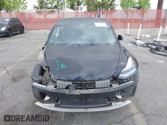 2019 Tesla Model 3 Mid Range with VIN 5YJ3E1EA3KF415601, listed as a IAAI auction lot 42125393 with 150,220 mi miles and . Bid and sale history available at carsss.com. Image 13.