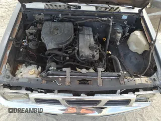 1996 Nissan Frontier XE z VIN 1N6SD16S4TC308641, wystawiony jako Copart lot #77328574 z przebiegiem Nie podano mil oraz Szkoda całkowita • Salvage title. Historia ofert i sprzedaży dostępna na DreamBid. Obrazek 11.