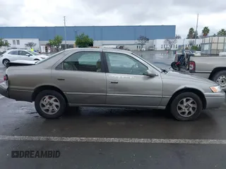 1998 Toyota Camry LE z VIN JT2BG22K7W0225872, wystawiony jako IAAI lot #41252434 z przebiegiem 160 763 mil mil oraz . Historia ofert i sprzedaży dostępna na DreamBid. Obrazek 13.