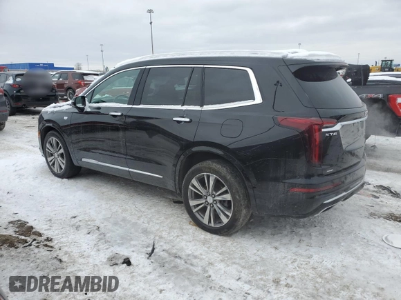 2021 Cadillac XT6 Premium Luxury with VIN 1GYKPDRS3MZ165049, listed as a Copart auction lot 45456145 with 57,112 mi miles and Salvage title. Bid and sale history available at DreamBid. Image 2.