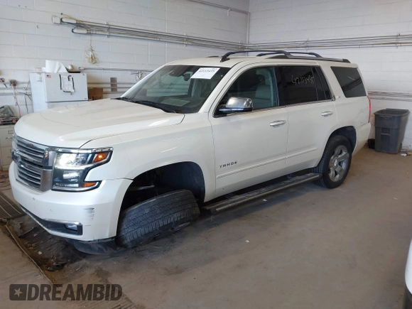 2015 Chevrolet Tahoe LTZ with VIN 1GNSKCKC9FR123996, listed as a IAAI auction lot 42113435 with 149,825 mi miles and . Bid and sale history available at DreamBid. Image 17.
