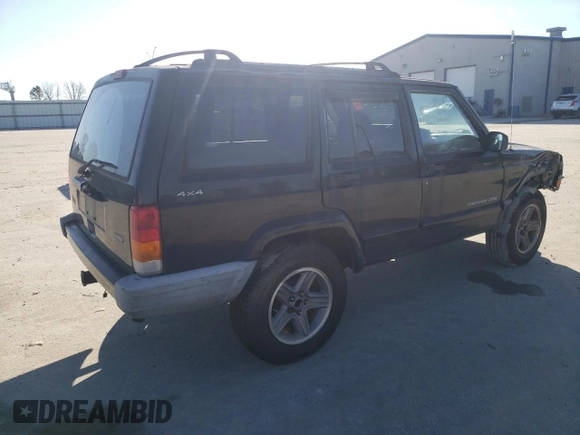 2000 Jeep Cherokee Classic with VIN 1J4FF58S3YL171454, listed as a Copart auction lot 42945485 with 218,721 mi miles and Salvage Title. Bid and sale history available at carsss.com. Image 3.