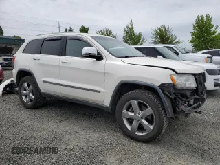 2011 Jeep Grand Cherokee Overland with VIN 1J4RR6GT9BC696319, listed as a Copart auction lot 56914185 with 211,661 mi miles and Salvage title. Bid and sale history available at DreamBid. Image 4.