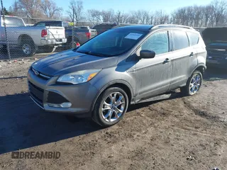 2014 Ford Escape SE z VIN 1FMCU9GXXEUB99093, wystawiony jako IAAI lot #41662040 z przebiegiem 120 783 mil mil oraz . Historia ofert i sprzedaży dostępna na DreamBid. Obrazek 18.