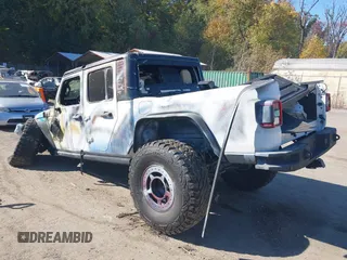 2020 Jeep Gladiator Sport S with VIN 1C6HJTAG3LL109494, listed as a IAAI auction lot 40677949 with 52,079 mi miles and . Bid and sale history available at DreamBid. Image 3.