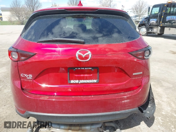 2021 Mazda CX-5 Touring z VIN JM3KFBCM1M0401717, wystawiony jako IAAI lot #42036407 z przebiegiem 35 587 mil mil oraz . Historia ofert i sprzedaży dostępna na DreamBid. Obrazek 16.
