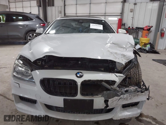 2014 BMW 6 Series 650i xDrive z VIN WBA6B4C55ED371378, wystawiony jako IAAI lot #41640888 z przebiegiem 80 927 mil mil oraz . Historia ofert i sprzedaży dostępna na DreamBid. Obrazek 12.