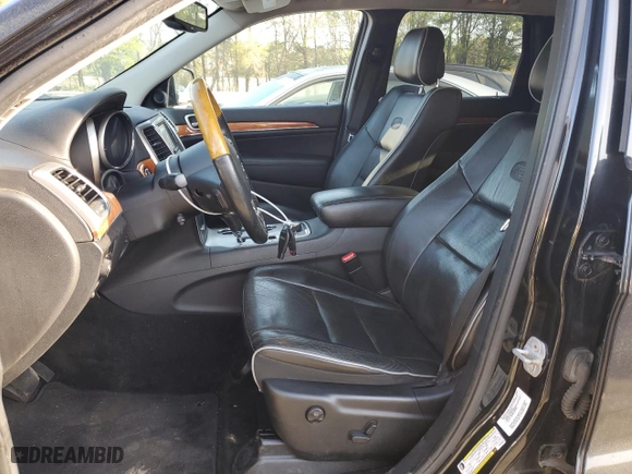 2012 Jeep Grand Cherokee Overland with VIN 1C4RJFCG4CC292383, listed as a Copart auction lot 51168385 with 132,697 mi miles and Salvage Title. Bid and sale history available at carsss.com. Image 7.