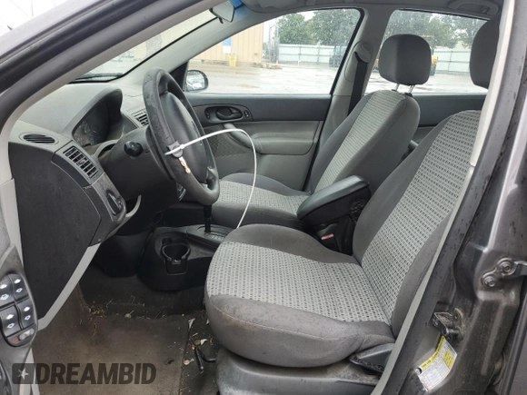 2007 Ford Focus S z VIN 1FAHP34N27W144992, wystawiony jako Copart lot #65571385 z przebiegiem 194 933 mil mil oraz Szkoda całkowita • Salvage title. Historia ofert i sprzedaży dostępna na DreamBid. Obrazek 7.