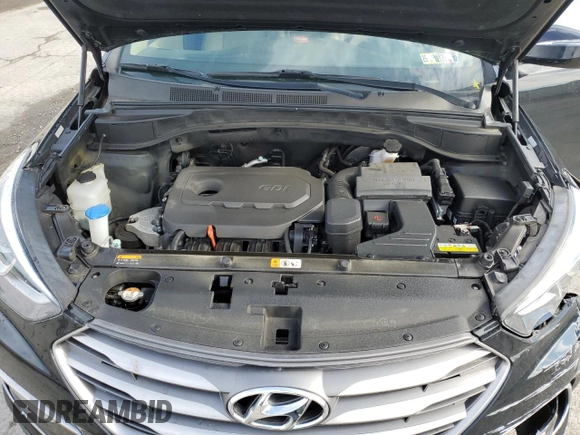 2017 Hyundai Santa Fe 2.4L z VIN 5XYZUDLB1HG412675, wystawiony jako Copart lot #57169045 z przebiegiem 38 947 mil mil oraz Szkoda całkowita • Salvage title. Historia ofert i sprzedaży dostępna na DreamBid. Obrazek 12.