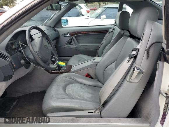 1997 Mercedes-Benz SL 500 with VIN WDBFA63F5VF143197, listed as a Copart auction lot 45003735 with 100,252 mi miles and Salvage title. Bid and sale history available at DreamBid. Image 7.