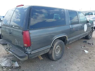 1999 Chevrolet Suburban with VIN 1GNEC16R9XJ502770, listed as a IAAI auction lot 42000467 with 245,844 mi miles. Bid and sale history available at carsss.com. Image 4.