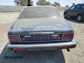 1992 Jaguar XJ with VIN SAJHY174XNC649368, listed as a Copart auction lot 50191454 with 99,553 mi miles and Salvage Title. Bid and sale history available at DreamBid. Image 6.