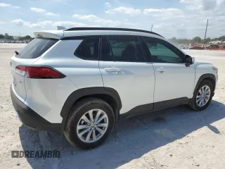 2024 Toyota Corolla Cross LE with VIN 7MUCAAAG7RV090677, listed as a Copart auction lot 57615565 with 6,910 mi miles and Salvage title. Bid and sale history available at DreamBid. Image 3.