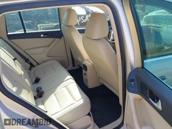 2012 Volkswagen Tiguan SE with VIN WVGBV7AX7CW580259, listed as a IAAI auction lot 42719624 with 94,710 mi miles and . Bid and sale history available at DreamBid. Image 8.