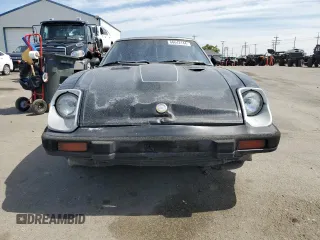 1982 Datsun 280ZX z VIN JN1HZ04SXCX448748, wystawiony jako Copart lot #87670125 z przebiegiem 136 264 mil mil oraz Szkody całkowita. Historia ofert i sprzedaży dostępna na DreamBid. Obrazek 5.