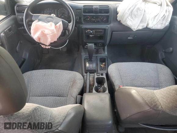 1999 Isuzu Rodeo S with VIN 4S2CK58W2X4312468, listed as a Copart auction lot 85753294 with Not Provided miles and Salvage Title. Bid and sale history available at DreamBid. Image 8.