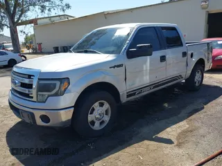 2014 Ford F-150 XL with VIN 1FTFW1CT3EKD12216, listed as a IAAI auction lot 42110775 with 140,673 mi miles. Bid and sale history available at carsss.com. Image 2.