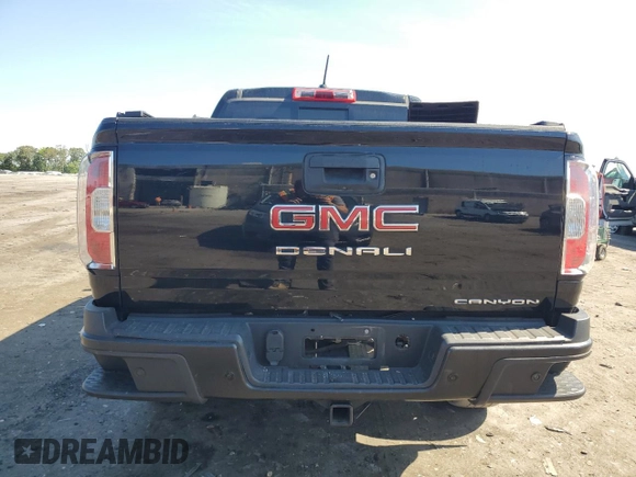 2021 GMC Canyon 4WD Denali with VIN 1GTG6EEN9M1255163, listed as a Copart auction lot 59868834 with 63,853 mi miles and Salvage Title. Bid and sale history available at carsss.com. Image 6.