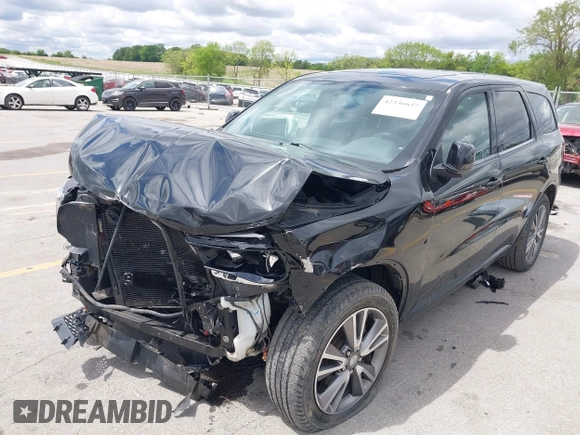 2013 Dodge Durango SXT with VIN 1C4RDJAG4DC697450, listed as a IAAI auction lot 42336657 with 177,476 mi miles and . Bid and sale history available at DreamBid. Image 2.