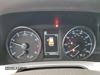 2018 Toyota RAV4 LE with VIN JTMBFREVXJJ226235, listed as a Copart auction lot 52299325 with 102,652 mi miles and Salvage Title. Bid and sale history available at carsss.com. Image 9.