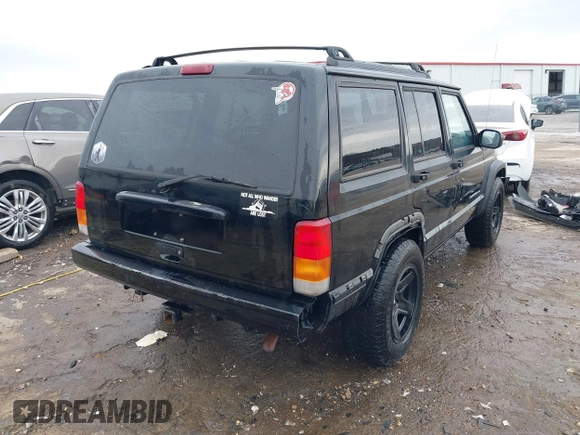 1999 Jeep Cherokee Sport with VIN 1J4FT68S6XL598558, listed as a IAAI auction lot 41549504 with 238,004 mi miles. Bid and sale history available at carsss.com. Image 4.