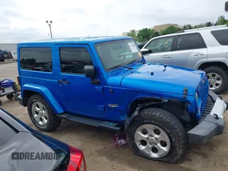 2015 Jeep Wrangler Sahara with VIN 1C4AJWBG9FL663959, listed as a IAAI auction lot 42133900 with 56,253 mi miles and . Bid and sale history available at DreamBid. Image 14.