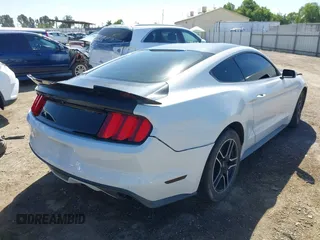 2016 Ford Mustang EcoBoost z VIN 1FA6P8TH3G5221133, wystawiony jako IAAI lot #42325336 z przebiegiem 135 065 mil mil oraz . Historia ofert i sprzedaży dostępna na DreamBid. Obrazek 4.
