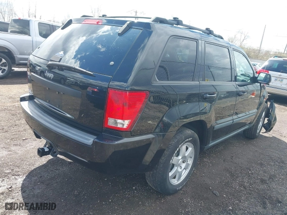 2009 Jeep Grand Cherokee Laredo with VIN 1J8GR48K99C550822, listed as a IAAI auction lot 41868508 with 179,436 mi miles. Bid and sale history available at carsss.com. Image 4.