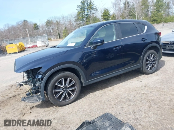 2018 Mazda CX-5 Touring z VIN JM3KFBCM4J0379871, wystawiony jako IAAI lot #41865130 z przebiegiem 48 674 mil mil oraz . Historia ofert i sprzedaży dostępna na DreamBid. Obrazek 2.