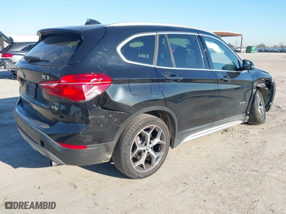 2018 BMW X1 sDrive28i with VIN WBXHU7C37J5H43318, listed as a IAAI auction lot 41294730 with 73,600 mi miles. Bid and sale history available at carsss.com. Image 4.