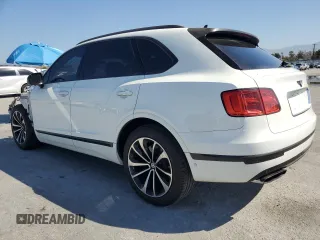 2018 Bentley Bentayga Signature z VIN SJAAC2ZV3JC016779, wystawiony jako Copart lot #54077865 z przebiegiem Nie podano mil oraz Szkoda całkowita • Salvage title. Historia ofert i sprzedaży dostępna na DreamBid. Obrazek 2.