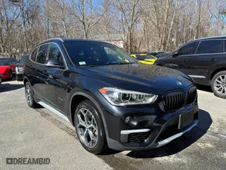 2017 BMW X1 xDrive28i with VIN WBXHT3C32H5F67896, listed as a IAAI auction lot 41823288 with 80,130 mi miles. Bid and sale history available at carsss.com. Image 1.