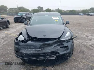 2024 Tesla Model Y with VIN 7SAYGDED8RF213927, listed as a IAAI auction lot 41386687 with 3,599 mi miles and . Bid and sale history available at DreamBid. Image 12.