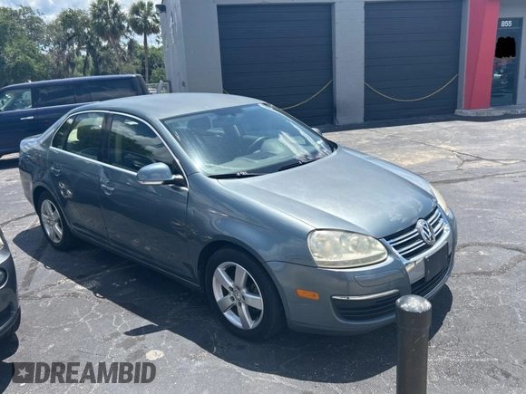 2006 Volkswagen Jetta z VIN 3VWRG81K46M724245, wystawiony jako Copart lot #57293785 z przebiegiem 212 639 mil mil oraz Czysty tytuł • Clean title. Historia ofert i sprzedaży dostępna na DreamBid. Obrazek 1.