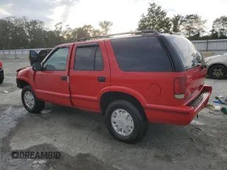 1996 GMC Jimmy SL with VIN 1GKDT13WXT2502347, listed as a Copart auction lot 74502444 with 253,735 mi miles and Salvage Title. Bid and sale history available at carsss.com. Image 2.