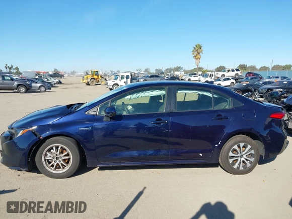 2021 Toyota Corolla Hybrid LE with VIN JTDEAMDEXMJ018828, listed as a IAAI auction lot 41633192 with 63,302 mi miles. Bid and sale history available at carsss.com. Image 15.