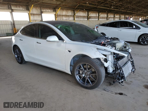 2020 Tesla Model 3 Standard Range Plus with VIN 5YJ3E1EA6LF645215, listed as a Copart auction lot 47882375 with 69,317 mi miles and Salvage Title. Bid and sale history available at DreamBid. Image 4.