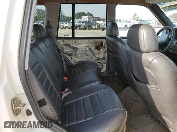 1996 Jeep Grand Cherokee Laredo z VIN 1J4EX58S3TC144191, wystawiony jako Copart lot #53153495 z przebiegiem 197 853 mil mil oraz Szkoda całkowita • Salvage title. Historia ofert i sprzedaży dostępna na DreamBid. Obrazek 10.