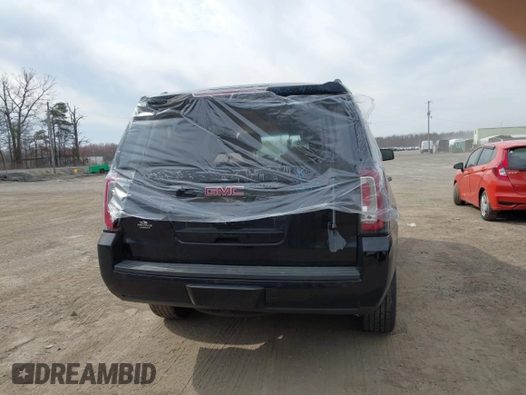2015 GMC Yukon SLT z VIN 1GKS1BKCXFR192349, wystawiony jako IAAI lot #41842474 z przebiegiem 185 166 mil mil oraz . Historia ofert i sprzedaży dostępna na DreamBid. Obrazek 16.