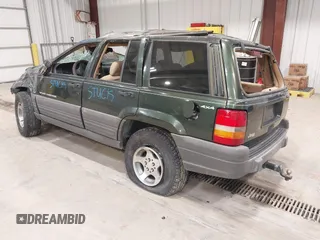 1997 Jeep Grand Cherokee Laredo z VIN 1J4GZ58YXVC729117, wystawiony jako IAAI lot #42244799 z przebiegiem Nie podano mil oraz . Historia ofert i sprzedaży dostępna na DreamBid. Obrazek 3.