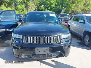 2017 Jeep Grand Cherokee Laredo with VIN 1C4RJFAGXHC817666, listed as a IAAI auction lot 42036817 with 119,698 mi miles. Bid and sale history available at carsss.com. Image 12.