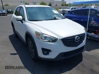 2016 Mazda CX-5 Grand Touring z VIN JM3KE2DY2G0824802, wystawiony jako IAAI lot #42170591 z przebiegiem 53 173 mil mil oraz . Historia ofert i sprzedaży dostępna na DreamBid. Obrazek 1.
