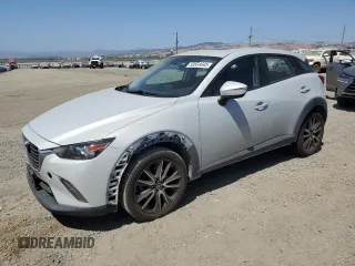 2017 Mazda CX-3 Touring z VIN JM1DKFC7XH0143198, wystawiony jako Copart lot #59554645 z przebiegiem 95 472 mil mil oraz Szkoda całkowita • Salvage title. Historia ofert i sprzedaży dostępna na DreamBid. Obrazek 1.