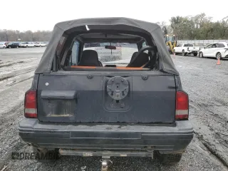 1992 Geo Tracker z VIN 2CNBJ18U8N6938728, wystawiony jako Copart lot #79459914 z przebiegiem 17 751 mil mil oraz Szkody całkowita. Historia ofert i sprzedaży dostępna na DreamBid. Obrazek 6.