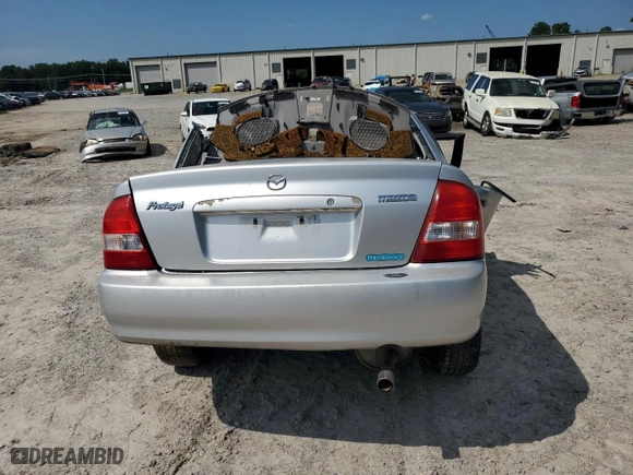 2002 Mazda Protege DX with VIN JM1BJ225821602734, listed as a Copart auction lot 65412644 with 0 mi miles and Clean Title. Bid and sale history available at carsss.com. Image 6.